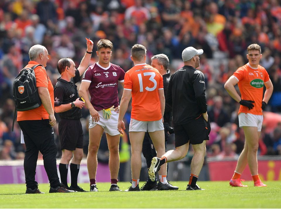 The two captains, Seán Kelly of Galway and Aidan Nugent of Armagh, are issued with red cards before the start of extra time after a melee at the GAA Football All-Ireland Senior Championship Quarter-Final match between Armagh and Galway.  Photo: Ray McManus/Sportsfile