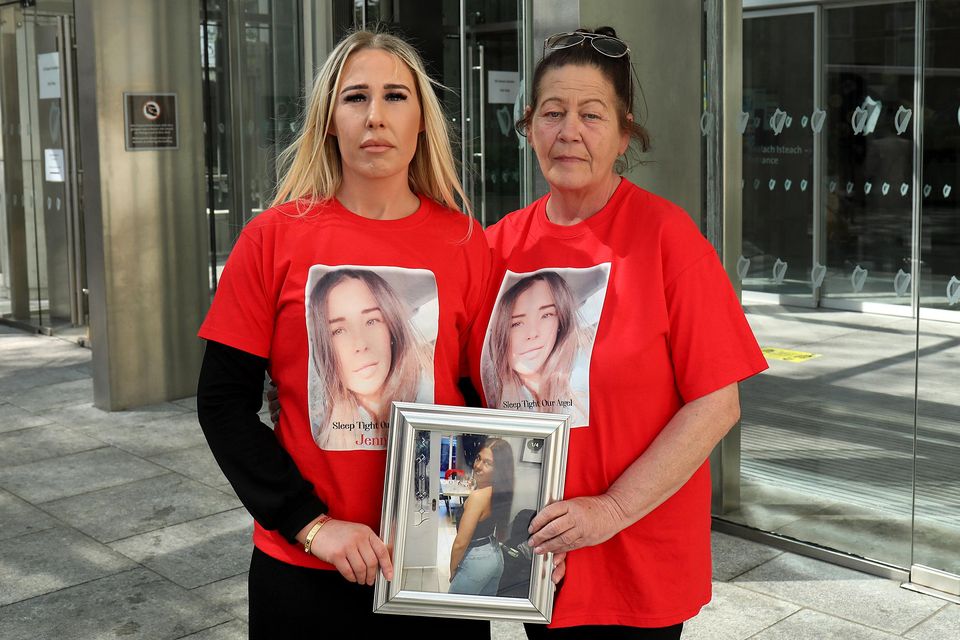 Clare and Jackie Poole, the sister and mother of Jennie, hold a framed photo of her outside Central Criminal Court. Photo: Collins Courts