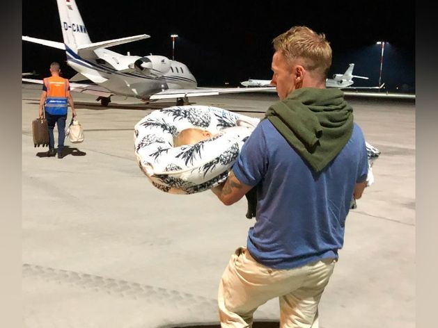 Ronan Keating carries baby onto private jet as wife Storm praises ‘beautiful heart’