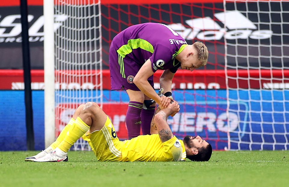 Fulham’s Aleksandar Mitrovic is consoled by Sheffield United goalkeeper Aaron Ramsdale after the striker missed a penalty and then conceded one in a 1-1 draw at Bramall Lane (PA)