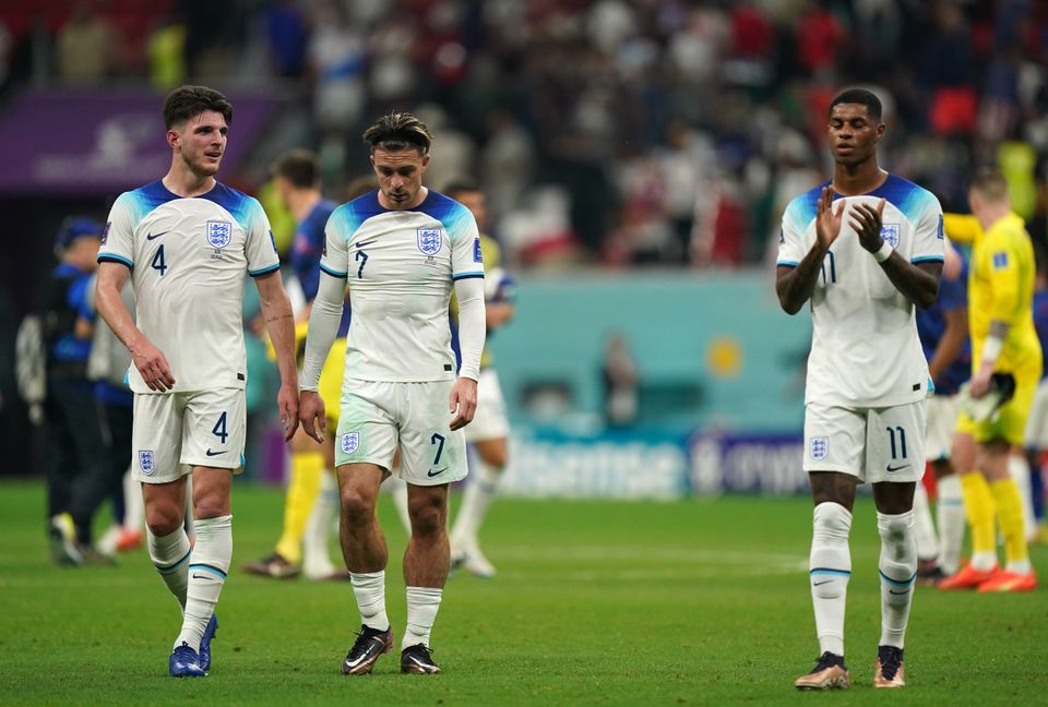 Left to right, England's Declan Rice, Jack Grealish and Marcus Rashford appear dejected after the FIFA World Cup Group B match at the Al Bayt Stadium in Al Khor, Qatar. Picture date: Friday November 25, 2022.