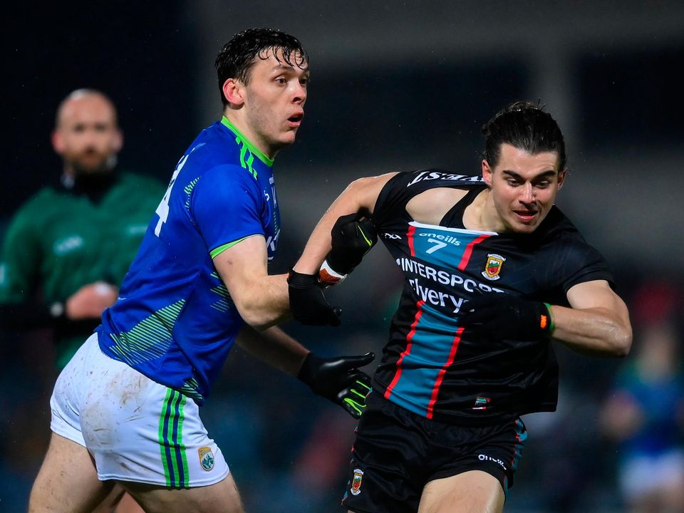Kerry's David Clifford, left, and Mayo''s Oisín Mullin tussle during the sides' Allianz Football League Division 1 clash at Austin Stack Park in Tralee. Photo: Stephen McCarthy/Sportsfile