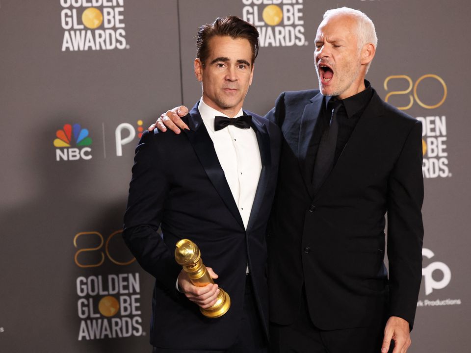 Director Martin McDonagh and Colin Farrell  pose with their award for Best Motion Picture in a Musical or Comedy for "The Banshees of Inisherin" at the 80th Annual Golden Globe Awards in Beverly Hills Photo: Reuters/Mario Anzuoni