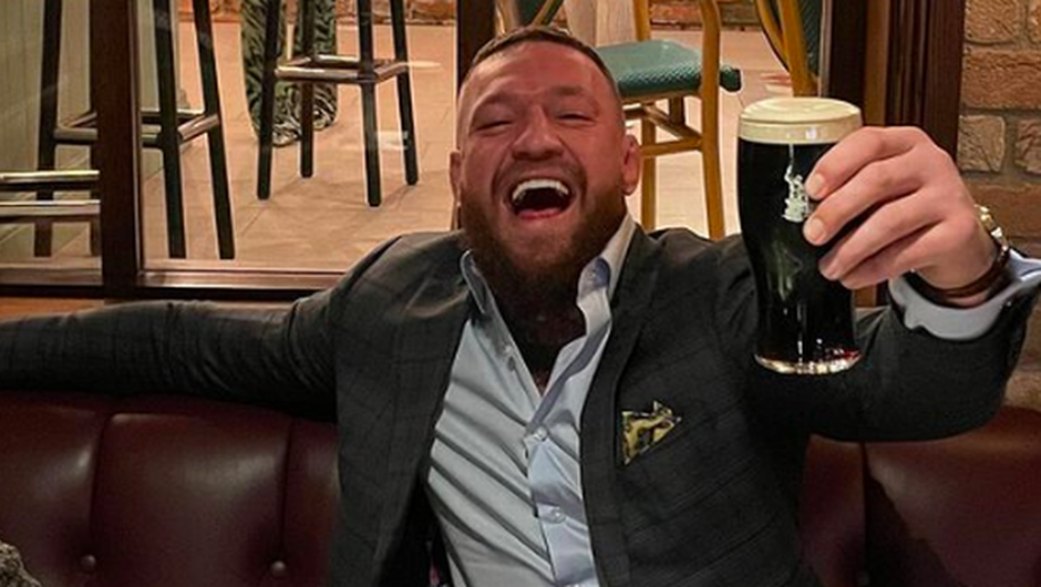Conor raises a glass after the fire-bombing incident