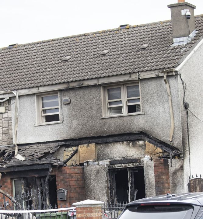 Gardaí at the scene in Finglas of the firebomb attack on the Whelan home