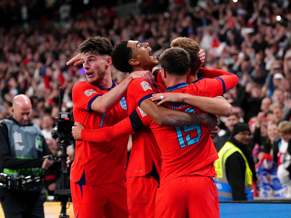 England's Harry Kane celebrates with his team-mates after scoring their side's third goal of the game from the penalty spot during the UEFA Nations League match at Wembley Stadium, London. Picture date: Monday September 26, 2022.