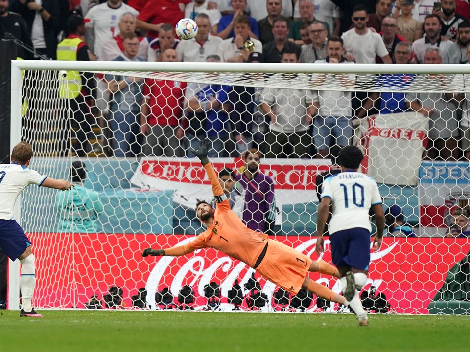 File photo dated 10-12-2022 of England's Harry Kane misses from the penalty spot. But a clash with defending champions France proved the end of the road as they were beaten 2-1, captain Harry Kane equalising with a penalty that saw him become his country's joint-highest scorer, then missing the chance to level again with another spot-kick late on, sending it over the bar. Issue date: Friday December 16, 2022.
