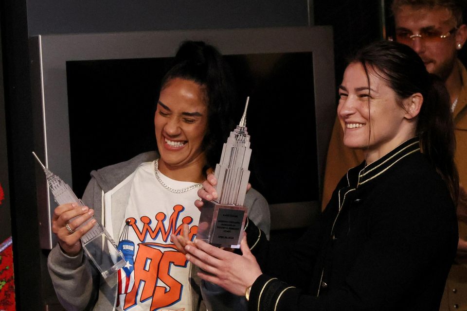 Boxers Katie Taylor and Amanda Serrano smile after lighting the Empire State Building promoting their World Lightweight Championship fight in New York City, U.S., April 26, 2022. REUTERS/Shannon Stapleton