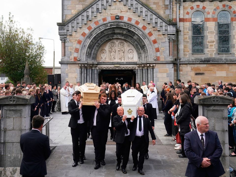 The coffins of siblings Grace and Luke McSweeney are carried out of Saints Peter and Paul’s Church, Clonmel