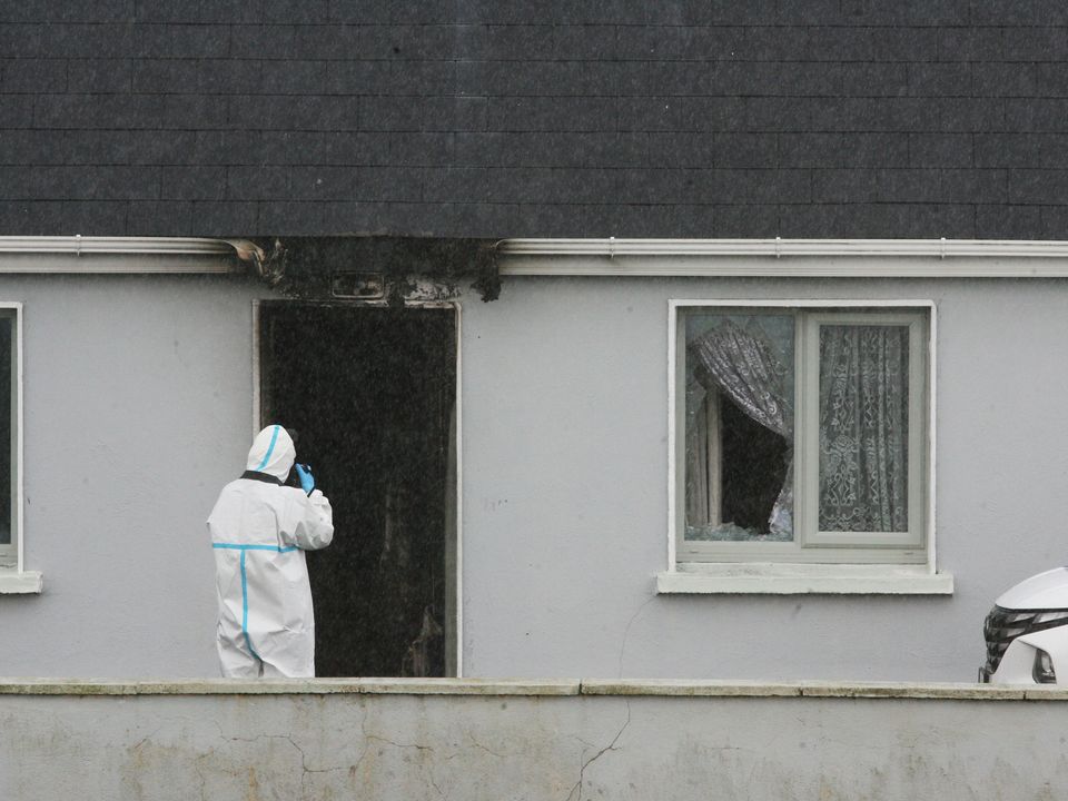 Scorch marks from a fire are seen at the house where John Brogan (82) was found murdered on Sunday. Photo: Padraig O'Reilly