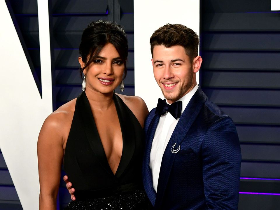 Priyanka Chopra and Nick Jonas have shared the first photo of their baby daughter (Ian West/PA)