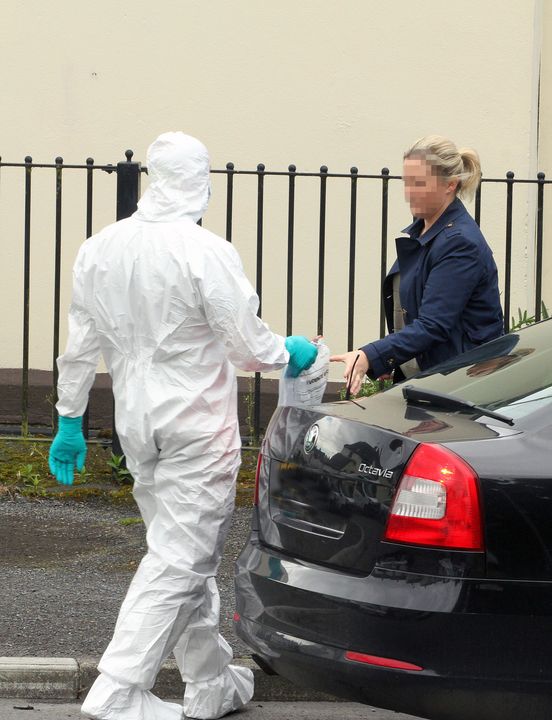 Forensic officers at the murder scene of Eamonn 'spud' O'Hanlon 36, who was stabbed to death in Gilford, County Down, in the early hours of Saturday.