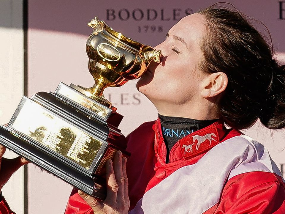 Rachael Blackmore kisses the Gold Cup after riding A Plus Tard to win The Boodles Cheltenham Gold Cup Chase on day four of The Festival at Cheltenham Racecourse. (Photo by Alan Crowhurst/Getty Images)