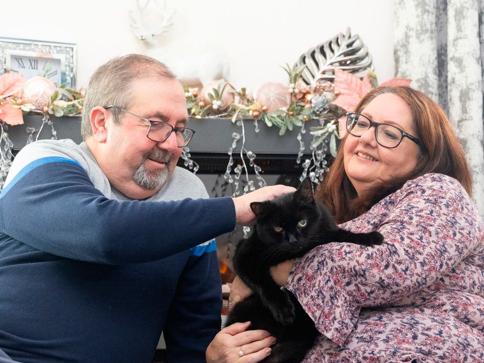 Billy the cat with Tony Pearce, 71 and his wife Deb Pearce, 63