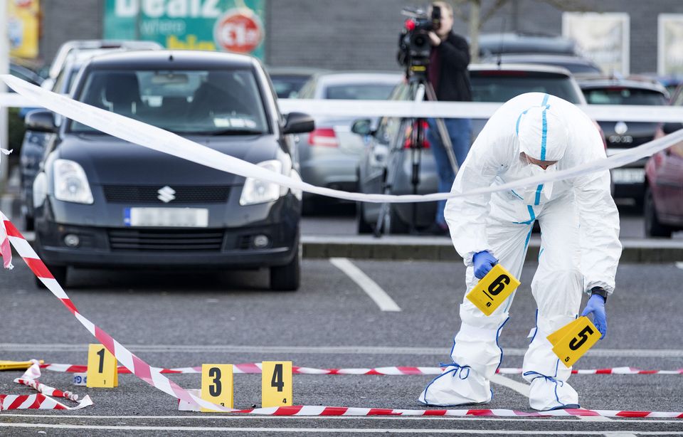 Gardai investigate at the shooting of Brendan Maguire at the M1 retail park in Drogheda