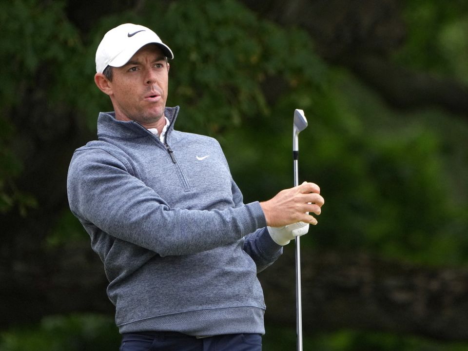 Rory McIlroy watches his shot from the sixth tee