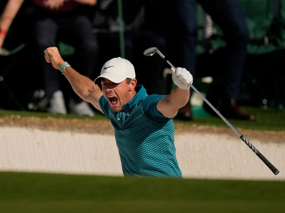 Rory McIlroy reacts after holing out from the bunker for a birdie during the final round at the Masters at Augusta. Photo: AP
