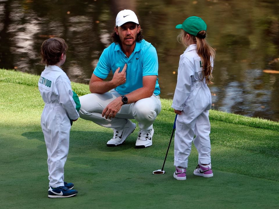 Tommy Fleetwood talks with his son Franklin and Shane Lowry's daughter Iris