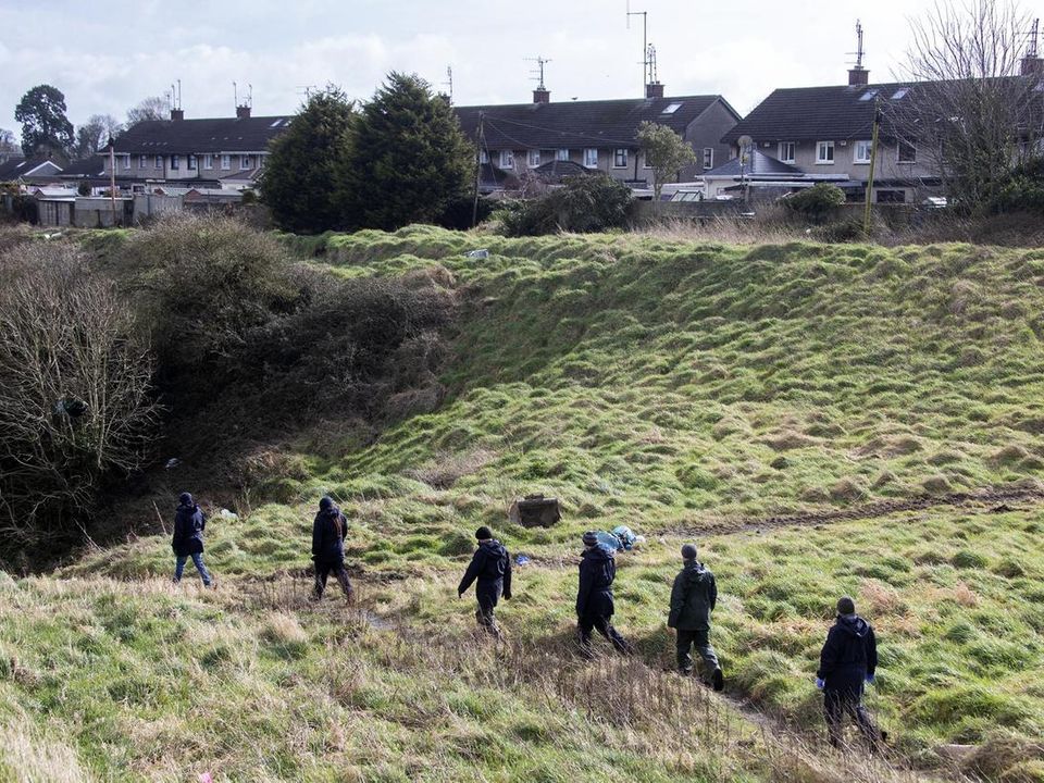 Gardai pictured at the site on wasteland in Drogheda where the torso of Keane Mulready Woods was discovered