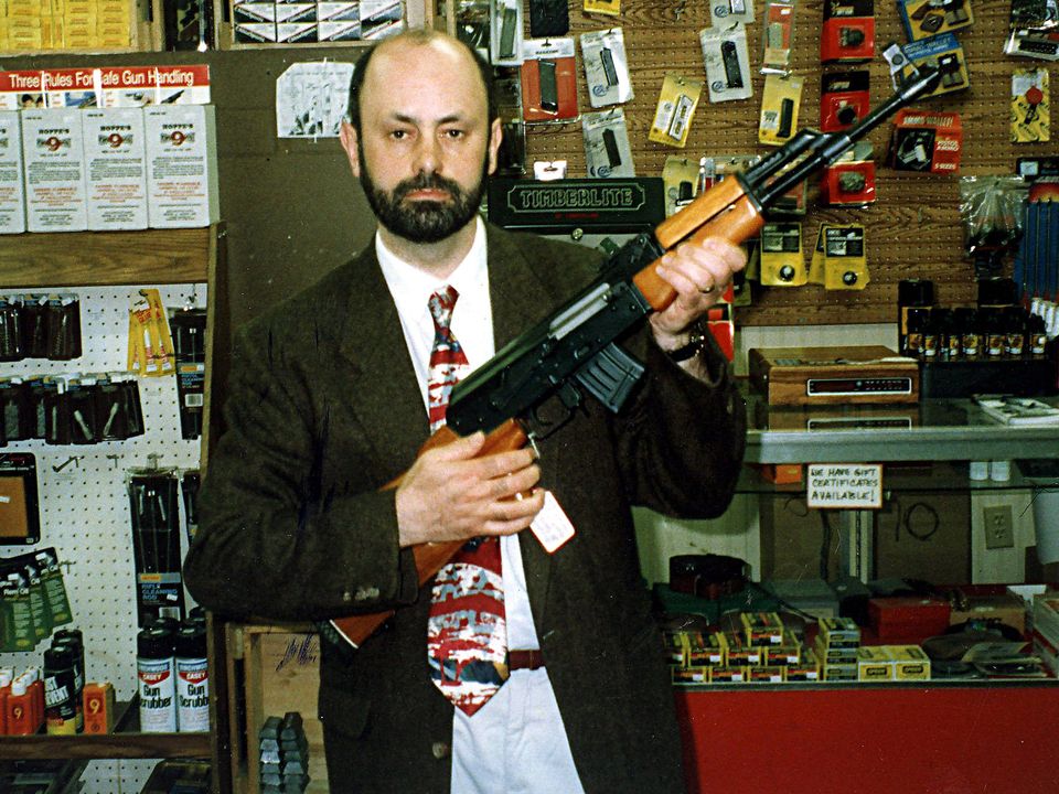 Des Ekin poses with a Kalashnikov AK 47 during his time at the Sunday World