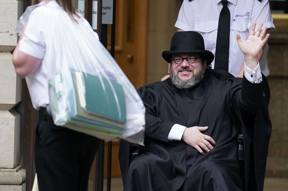 Nicholas Rossi leaves Edinburgh Sheriff and Justice Court last July (Andrew Milligan/PA)