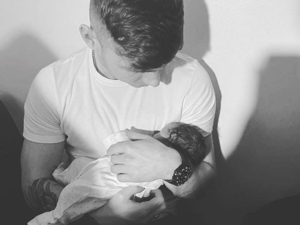 Jack Keating with his new baby.  Photo: Jack Keating/Instagram