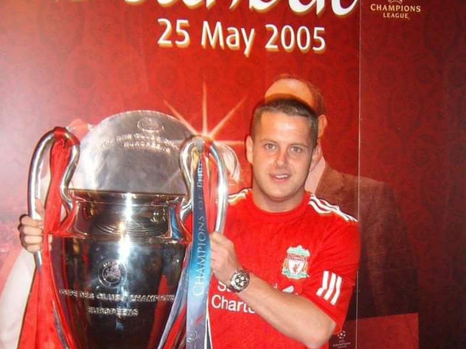 Liverpool fan William Gracey poses with the European Cup