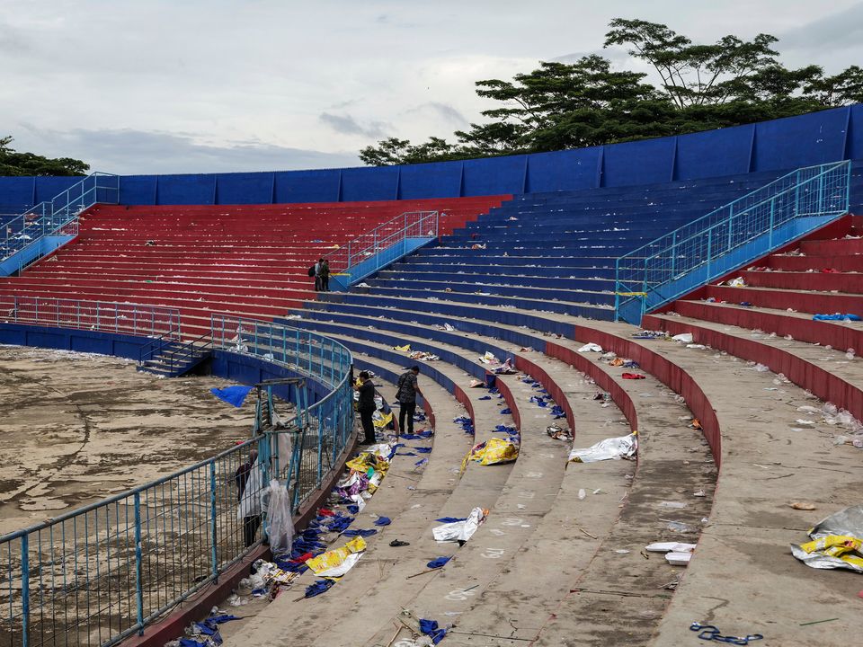 Shoes and belongings left inside the Kanjuruhan Stadium after the pitch invasion and stampede in Malang, Indonesia