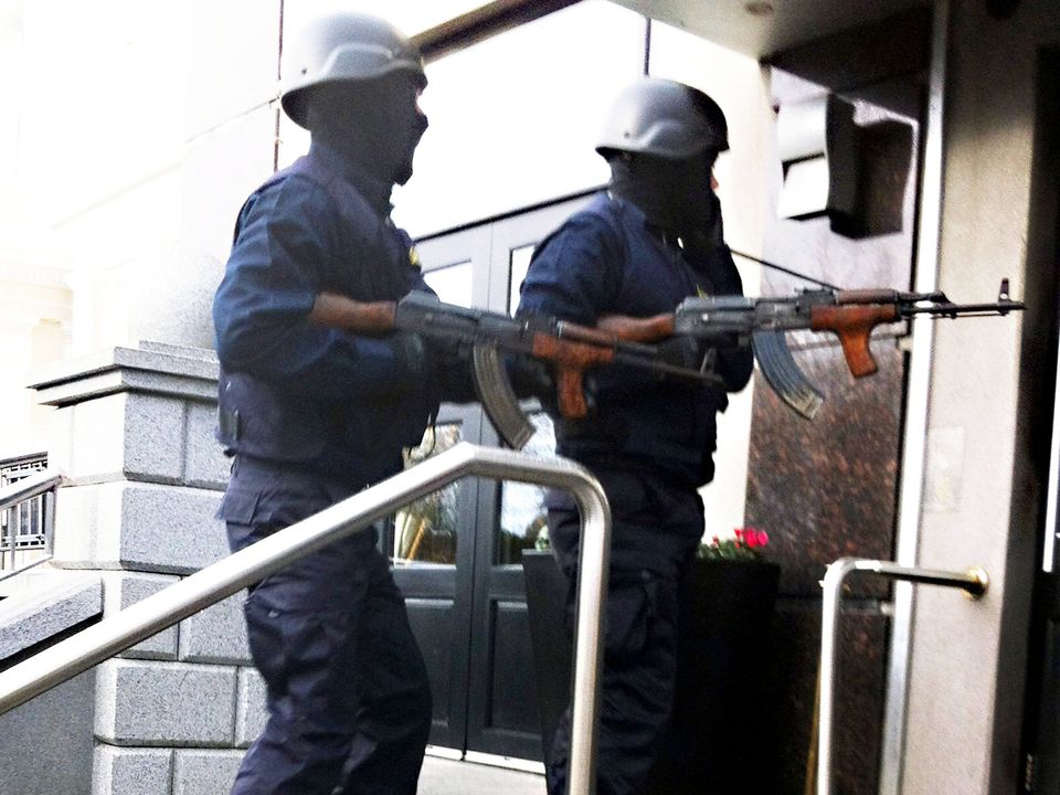 Armed assassins dressed as Garda ERU officers enter the Regency Hotel