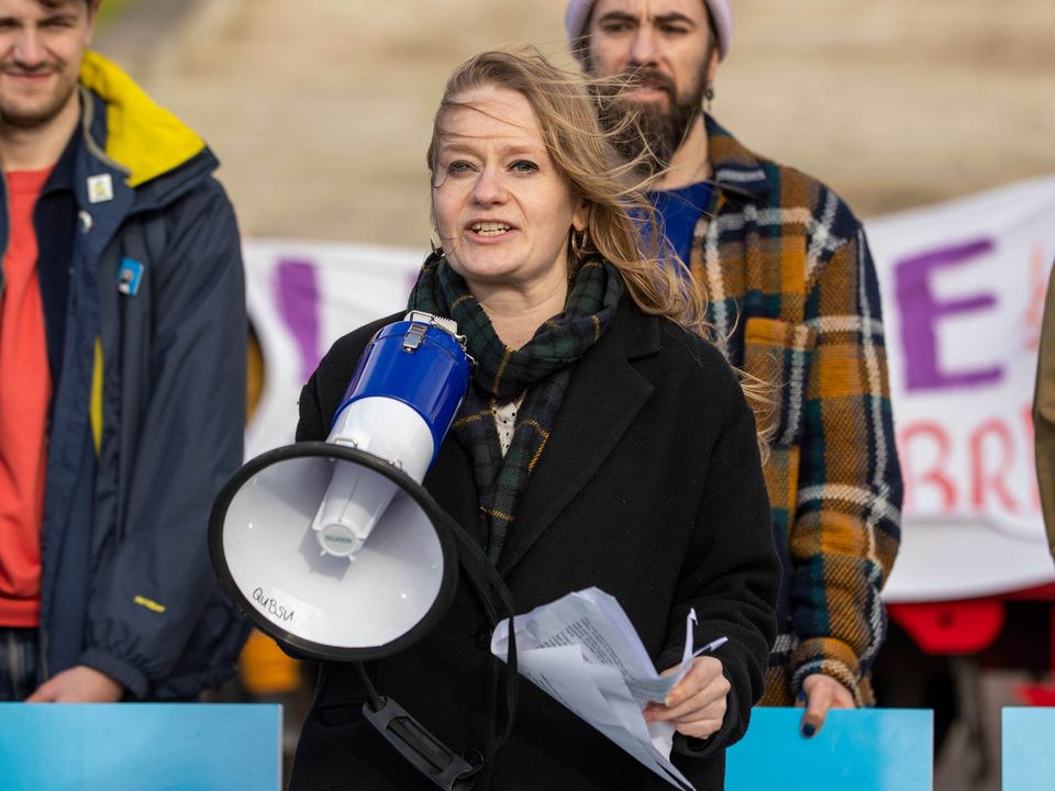 Rachel Woods speaking to a gathered crowd of climate activists at Stormont's Parliament Buildings.  Photo:  Liam McBurney/PA Wire...A