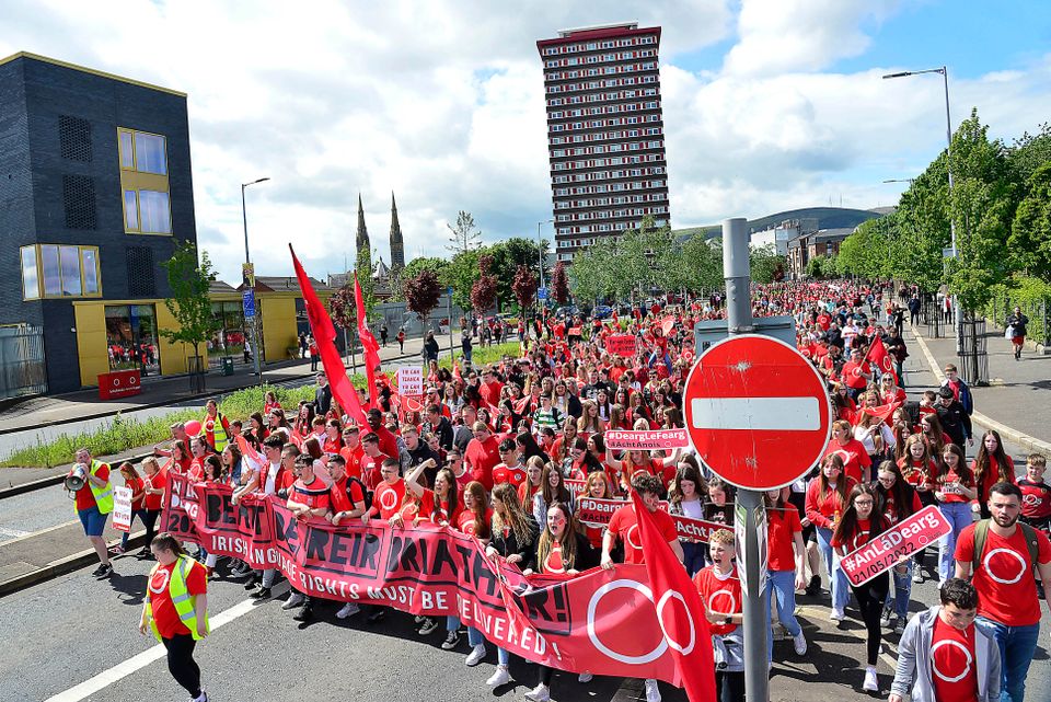 Tens of thousands of people campaigning for an Irish Language Act make their way past Divis Flats on the Falls Road in West Belfast Pic: Pacemaker