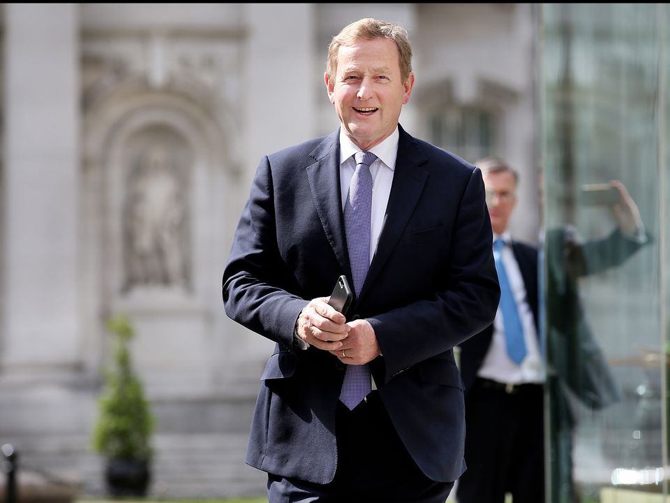 Taoiseach Enda Kenny TD leaves the Department of the Taoiseach for the last time as he heads to the Aras An Uachtarain
