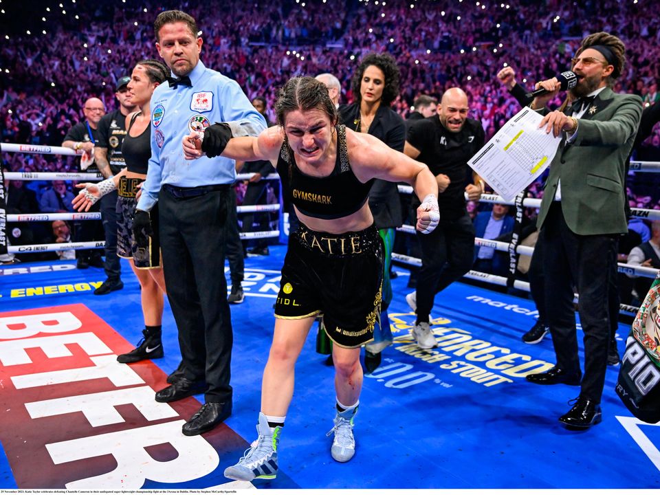 25 November 2023; Katie Taylor celebrates defeating Chantelle Cameron in their undisputed super lightweight championship fight at the 3Arena in Dublin. Photo by Stephen McCarthy/Sportsfile