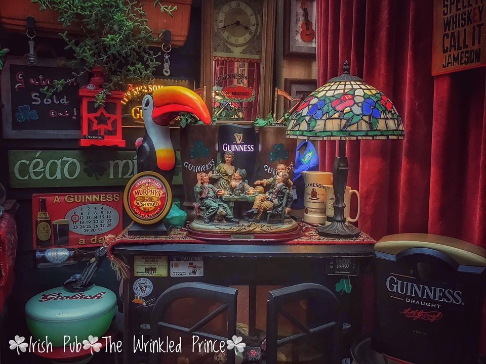 The Guinness toucan is seen in Geert's home built Irish pub.