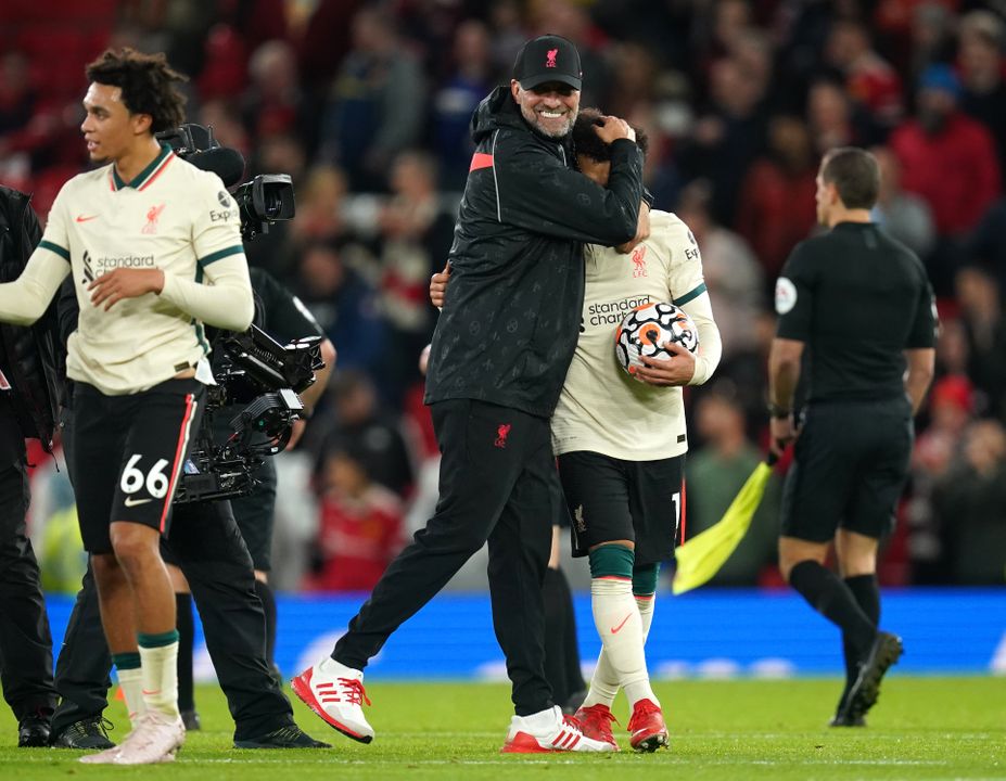 Jurgen Klopp (pictured centre) celebrates with hat-trick scorer Mohamed Salah after Liverpool’s 5-0 win over Man Utd at Old Trafford in October (Martin Rickett/PA Images).