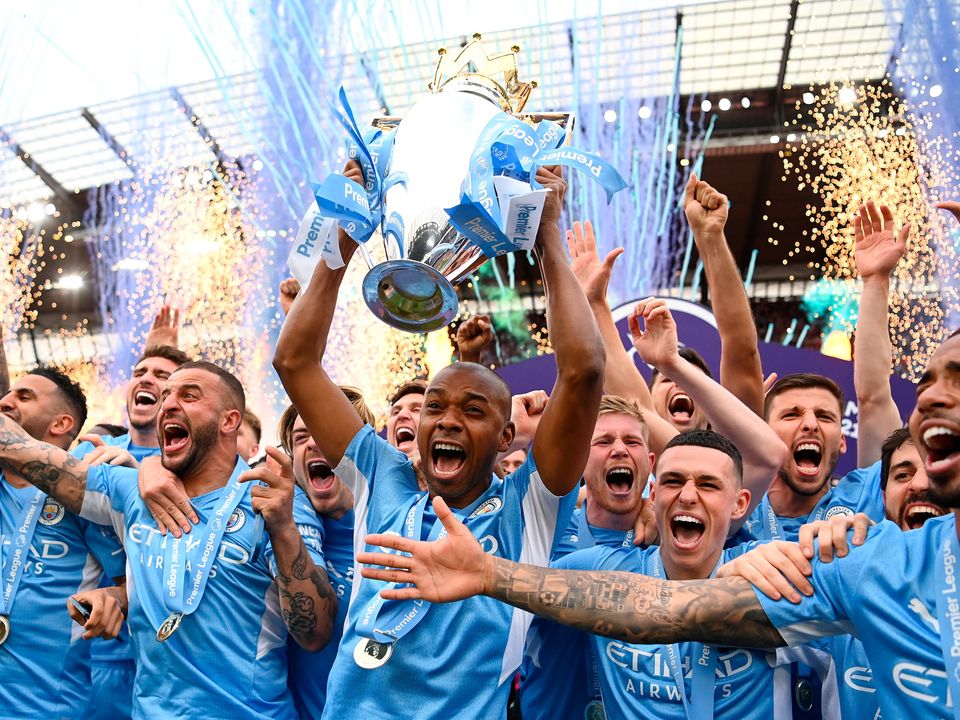 Fernandinho of Manchester City lifts the Premier League trophy after their side finished the season as Premier League champions . (Photo by Michael Regan/Getty Images)