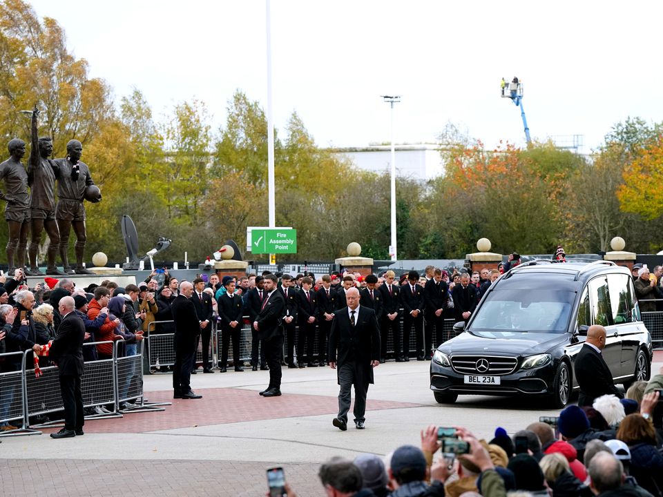 The funeral procession of Sir Bobby Charlton passes Old Trafford (Nick Potts/PA)