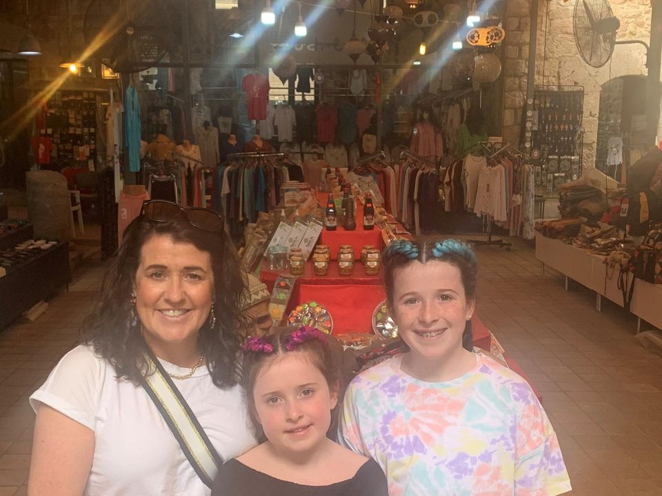 Sarah, Chloe and Mia check out a local market