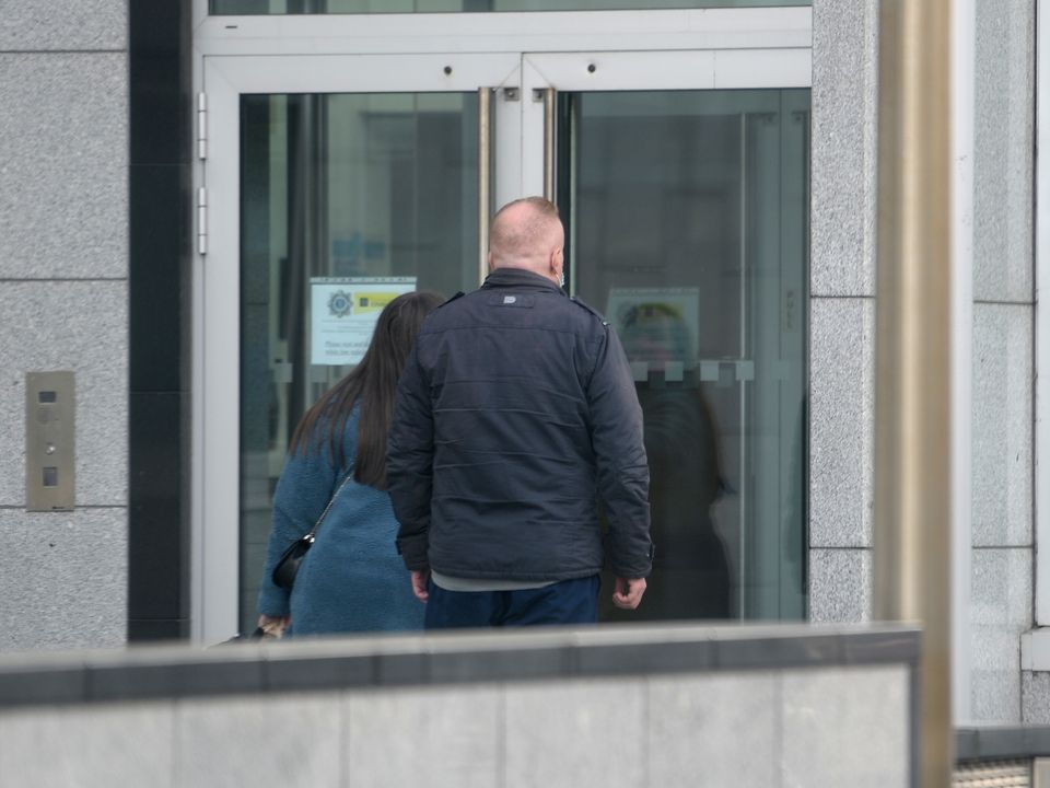 Sidney Sutton presents himself at Ballymun Garda station before being taken back to prison