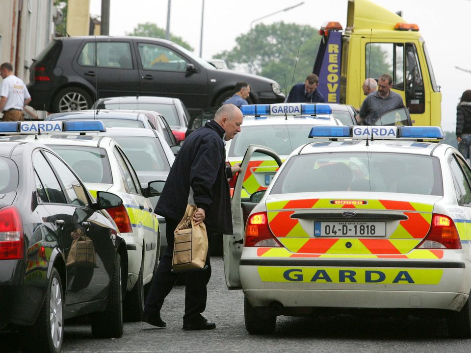 Gardai after raids following McGinley’s murder