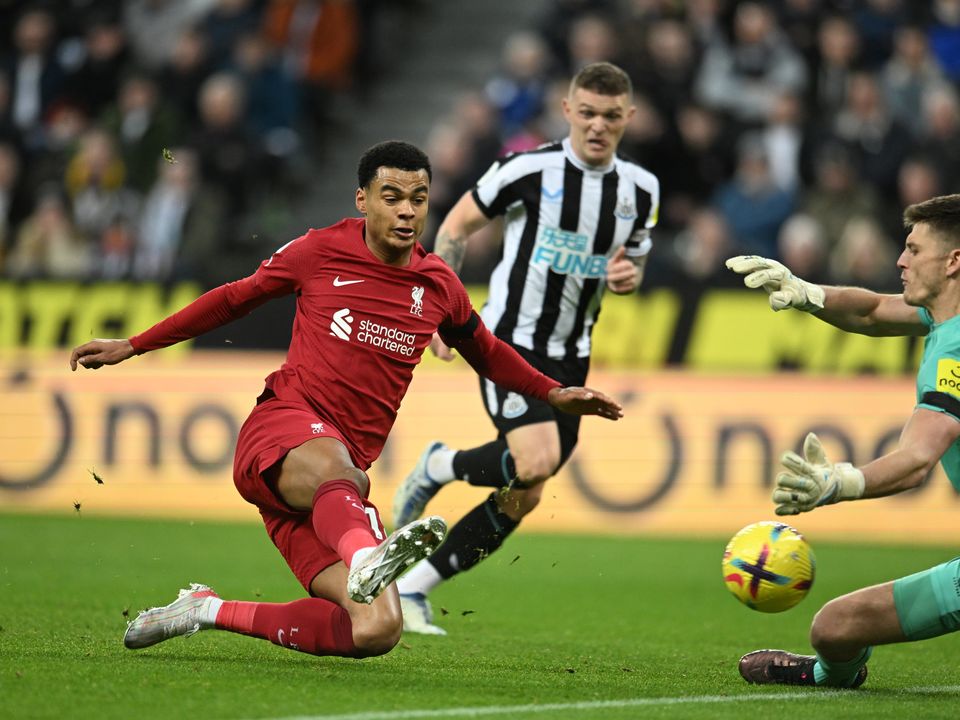 
NEWCASTLE UPON TYNE, ENGLAND - FEBRUARY 18:  (THE SUN OUT,THE SUN ON SUNDAY OUT)  Cody Gakpo of Liverpool scores the second goal making the score  0-2 during the Premier League match between Newcastle United and Liverpool FC at St. James Park on February