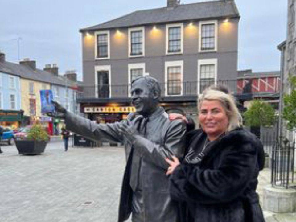 Kathleen poses with Joe Dolan's statue