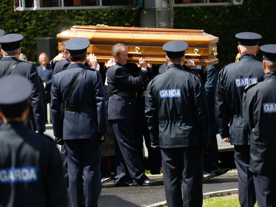 Officers carry the coffin at the funeral of Garda Colm Horkan