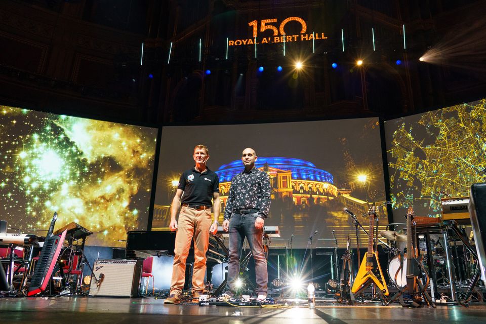 European Space Agency astronaut Tim Peake (left) pictured alongside composer Ilan Eshkeri onstage at the Royal Albert Hall (Dominic Lipinski/PA)