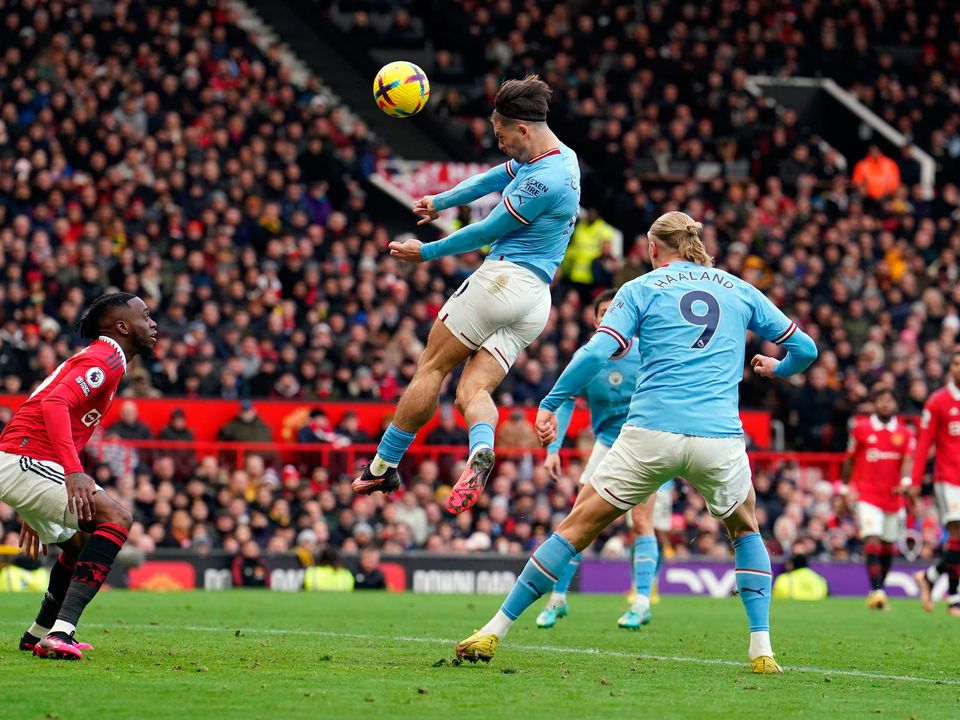 Manchester City's Jack Grealish scores the opening goal during the Premier League match at Old Trafford, Manchester. Picture date: Saturday January 14, 2023. PA Photo. See PA story SOCCER Man Utd. Photo credit should read: Martin Rickett/PA Wire.

RESTRICTIONS: EDITORIAL USE ONLY No use with unauthorised audio, video, data, fixture lists, club/league logos or "live" services. Online in-match use limited to 120 images, no video emulation. No use in betting, games or single club/league/player publications.