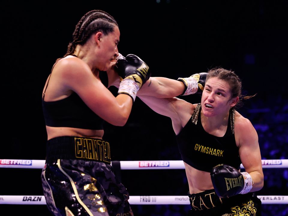 Chantelle Cameron exchanges punches with Katie Taylor during the IBF, IBO, WBA, WBC and WBO World Super Lightweight Title fight at The 3Arena, Dublin