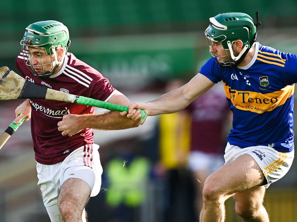Brian Concannon of Galway is tackled by Tipperary's Cathal Barrett in the All-Ireland senior hurling championship quarter-final