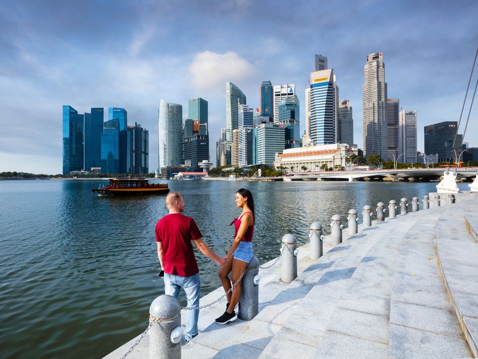 Stock image: Couple admiring Singapore downtown district (Photo: Getty)