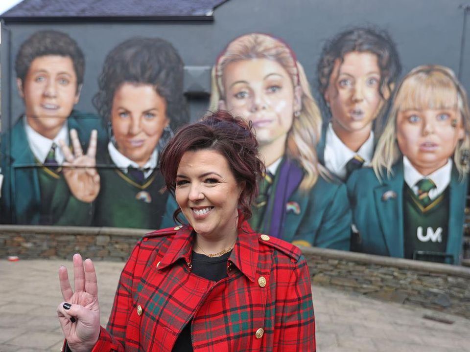 Derry Girls writer Lisa McGee at a mural inspired by the drama (Liam McBurney/PA)