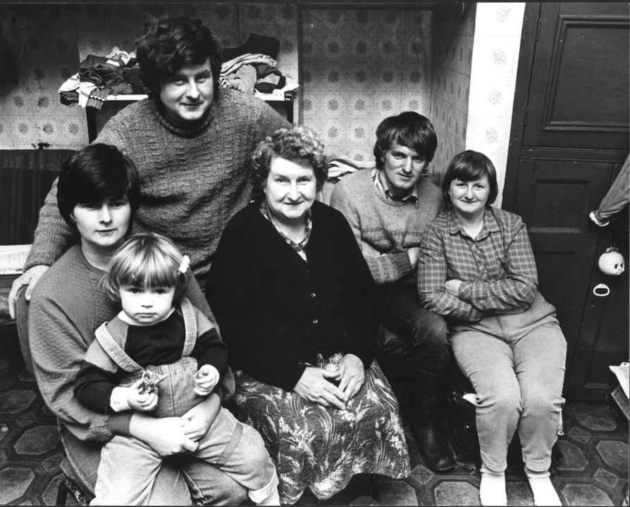 Joanne with her mother and family